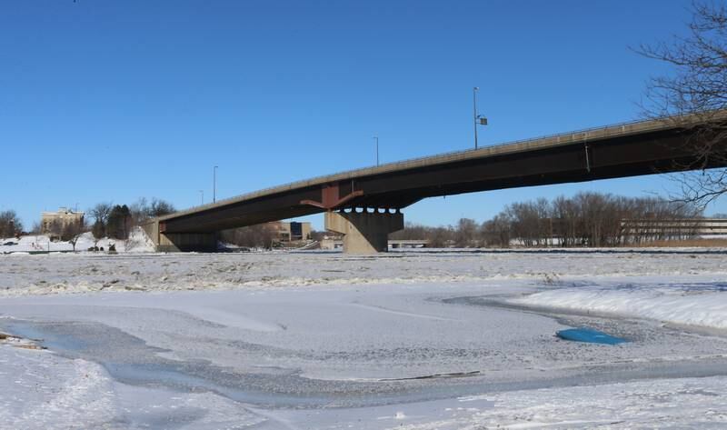 The Illinois River remains frozen underneath the Veterans Memorial Bridge on Tuesday, Jan. 16, 2024, in Ottawa.