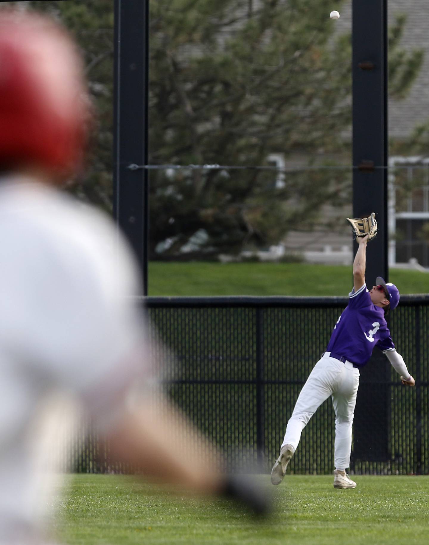 Hampshire's Ari Fivelson tracks down a fly ball hit by Huntley's Dylan Visvadra during a Fox Valley Conference baseball game on Monday, April 28, 2025, at Huntley High School.