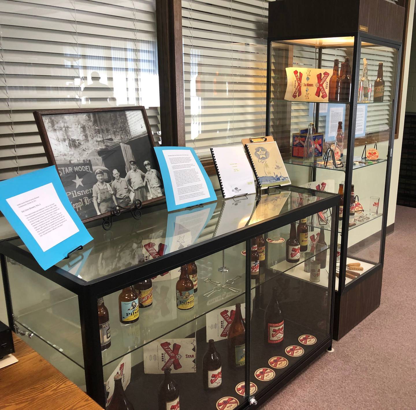 Beer bottles and other memorabilia from Star Union Brewery are on display at the Peru Public Library on Monday, July 18, 2022.