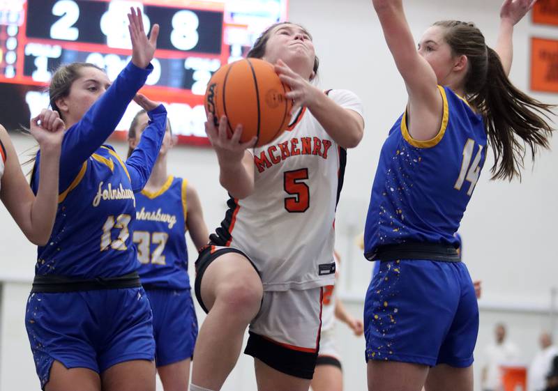 McHenry’s Gaby Grasser battles under the hoop against Johnsburg in varsity girls basketball on Saturday, Jan. 4, 2025, at McHenry High School in McHenry.