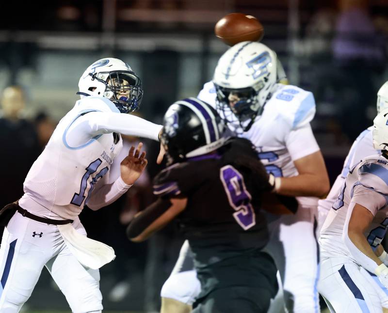 Prospect's Jackson Cacini (10) throws a rock to a teammate during the IHSA Class 7A playoff football game Friday, Oct. 31, 2025 in Downers Grove.