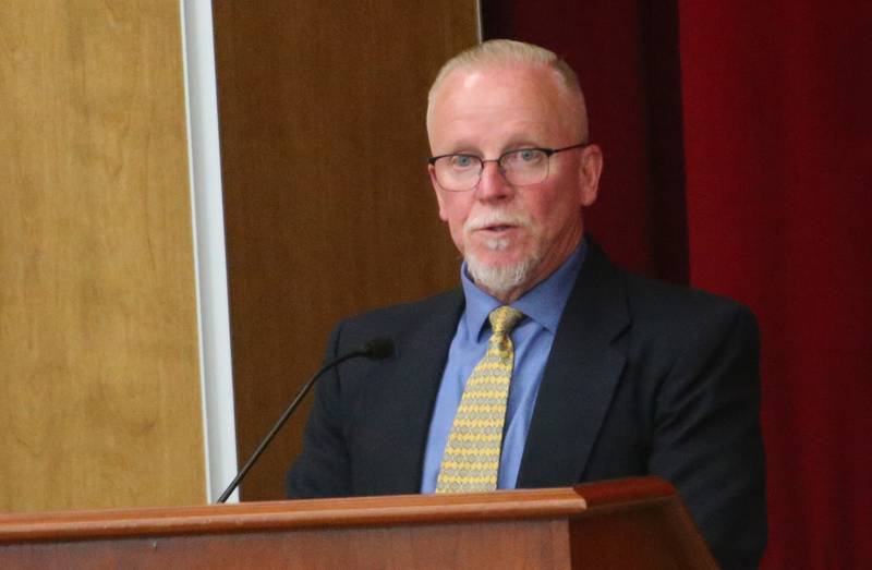 John Kniery, administrator with the Illinois Health Facilities and Services Review Board, speaks during a public hearing regarding OSF St. Elizabeth Hospital's plans to reduce services on Tuesday, June 10, at Central Intermediate School in Ottawa.