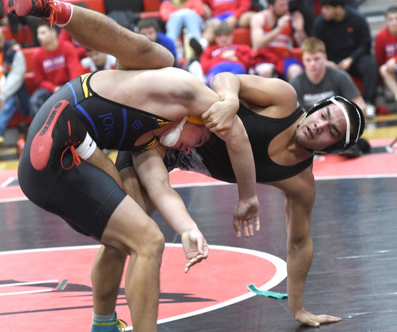 Marengo's Frankie Solis balances on one arm as he battles Johnsburg's Duke Mays in the championship match at 190 pounds at the Stillman Valley Holiday Tournament on Saturday, Dec. 20, 2025 at Stillman Valley High School.