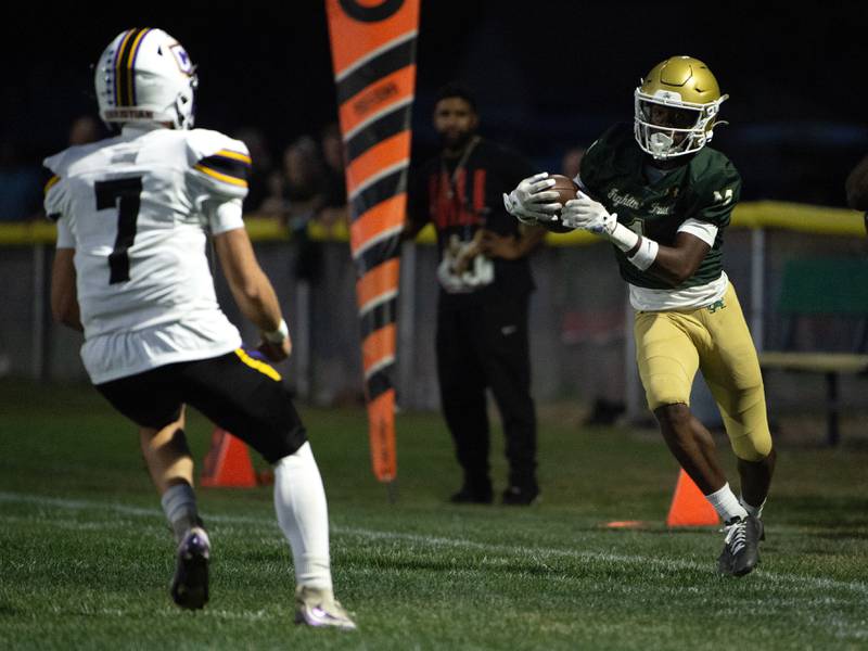 Bishop McNamara's Malachai Lee, right, tries to stay in bounds on a kick return while Chicago Christian's Tyce Hamstra, left, defends in a game on Friday, September 19, 2025.