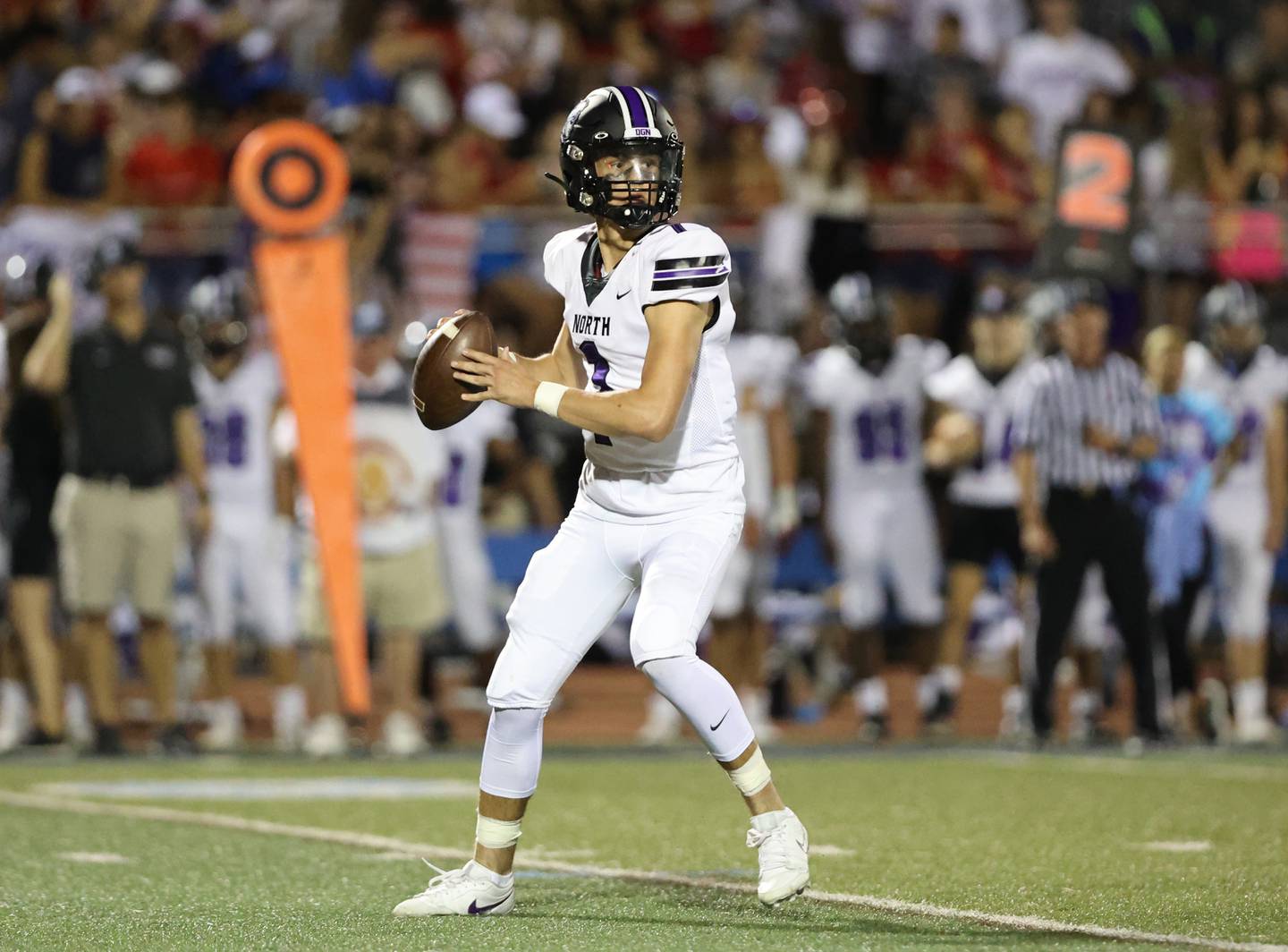 Downers Grove North’s Owen Lansu looks to pass the ball against Downers Grove South during the boys varsity football game on Friday, Sept. 1, 2023.