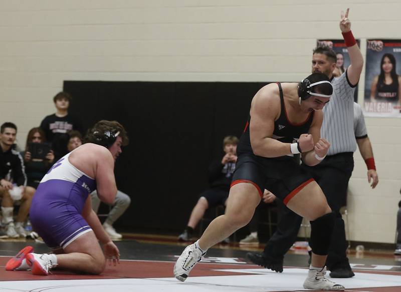 Huntley’s Markos Mihalopolus celebrates defeating Hampshire's Joseph Ochoa during the 285-pound match of a Fox Valley Conference wrestling match Wednesday, Jan. 24, 2024, at Huntley High School.