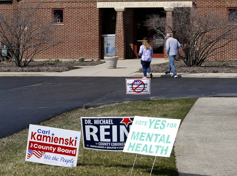 Voters walk into the Johnsburg Public Library to cast their votes on Tuesday, March 19, 2024, in the spring primary election.