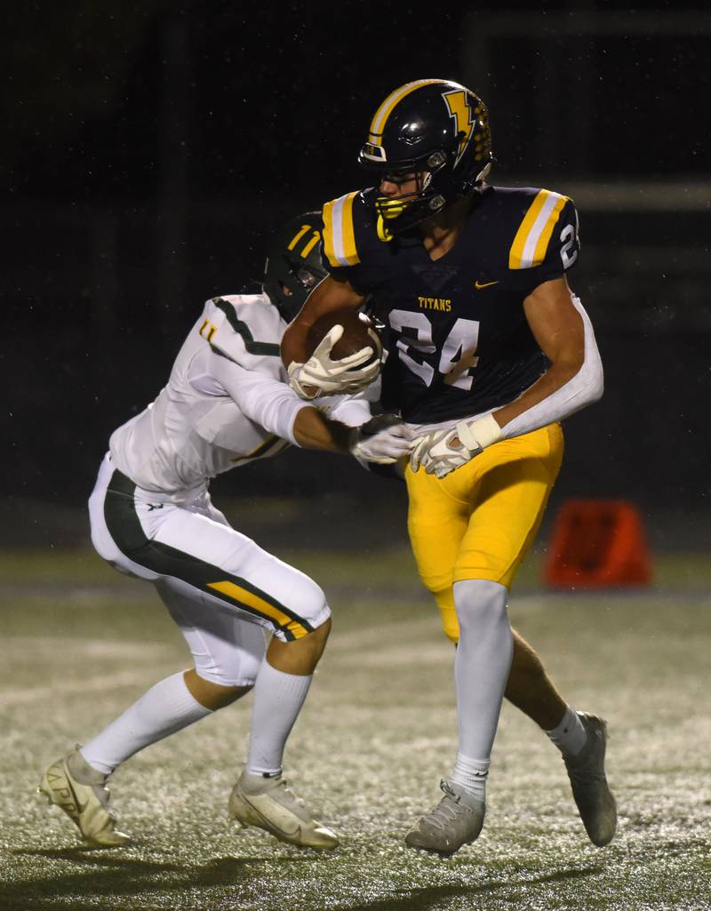 Glenbrook South’s Tommy MacPherson gets past Glenbrook North's Connor Durst during Friday’s game in Glenview.