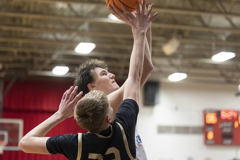 Newman’s Asher Ernst puts up a shot against Pecatonica’s Conner Berg Tuesday, March 3, 2026, in the 1A sectional semifinal.