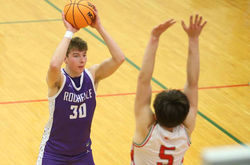 Rochelle's Warren Schweitzer looks to pass the ball over the head of L-P's Erick Sotelo on Friday, Feb. 13, 2026 in Sellett Gymnasium at L-P High School.