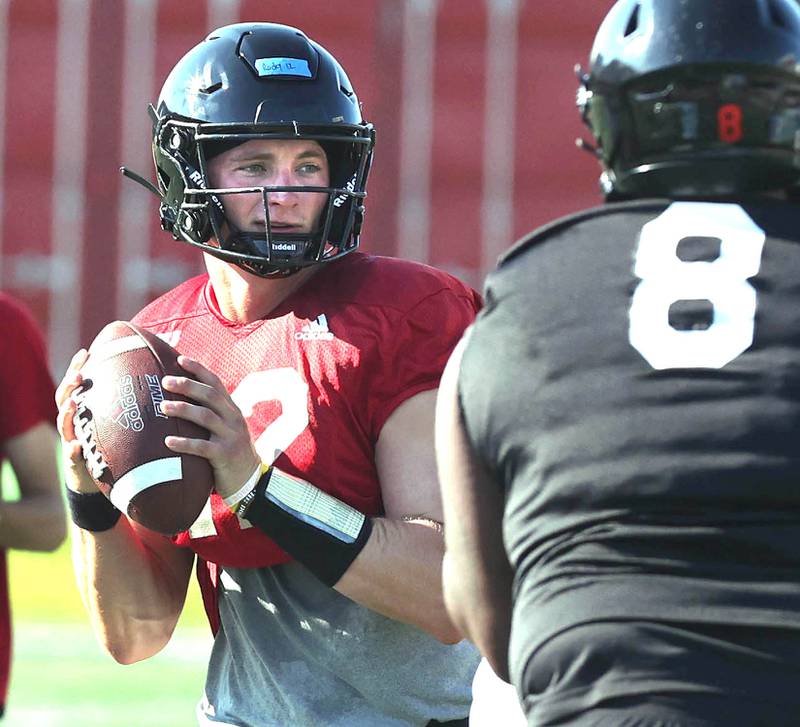 Northern Illinois University quarterback Rocky Lombardi looks for a receiver during a goal line drill Monday, August 1, 2022, at practice at Huskie Stadium in DeKalb.