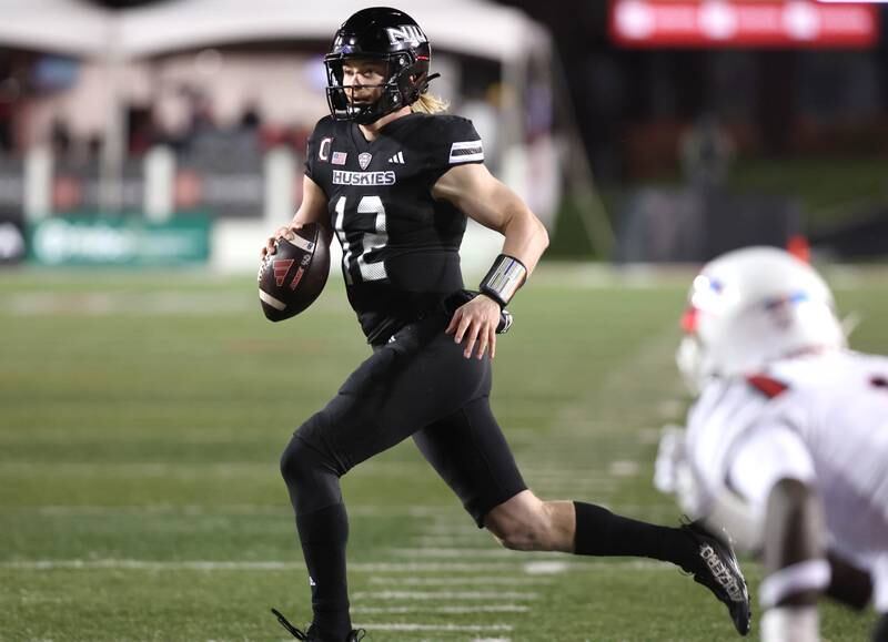 Northern Illinois' Rocky Lombardi escapes the Ball State pressure and runs for a touchdown during their game Tuesday, Nov. 7, 2023, in Huskie Stadium at NIU in DeKalb.