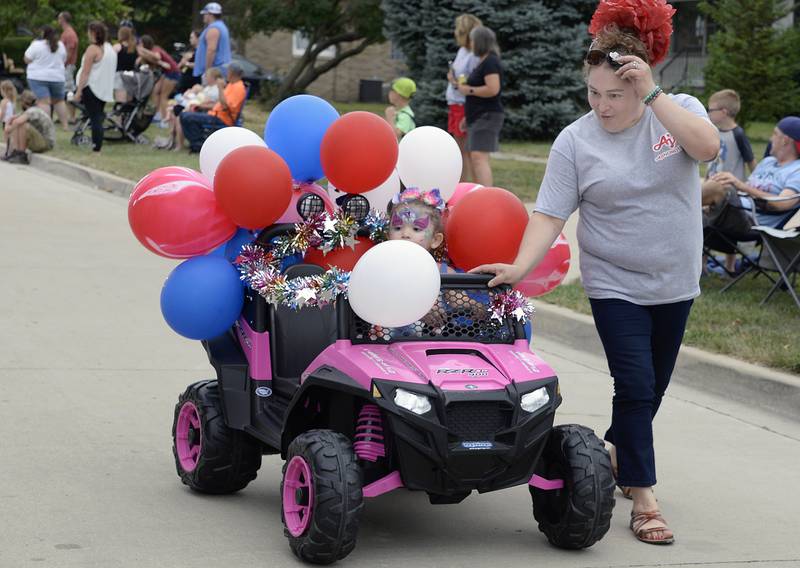 Those not old enough to drive got some assistance Sunday, Aug. 14, 2022, as they rode down Walnut Street during the Wenona Days parade.