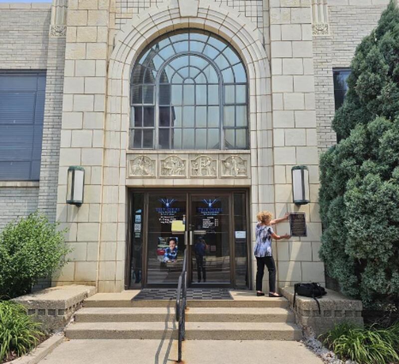 The city of Sterling pledged more that $58,000 in ARPA funds for four projects, one of which is installing bronze historic plaques in the downtown. Once such plaque may be installed at City Hall, as city administrative assistant Deb Dillow illustrates here.
