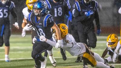 Photos: Carmel, St. Charles North football meet in second round playoff action
