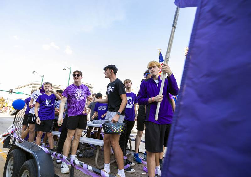 The Dixon boys cross country team ride through the homecoming parade Friday, Oct. 3, 2025.
