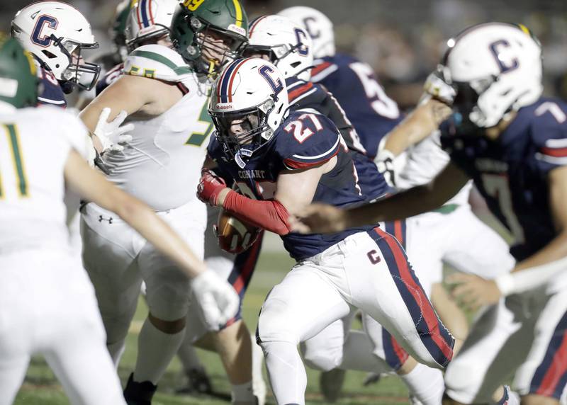Conant's Dominic Mininni, (27) heads in for a touchdown Friday, Sept. 9, 2022, in Schaumburg.