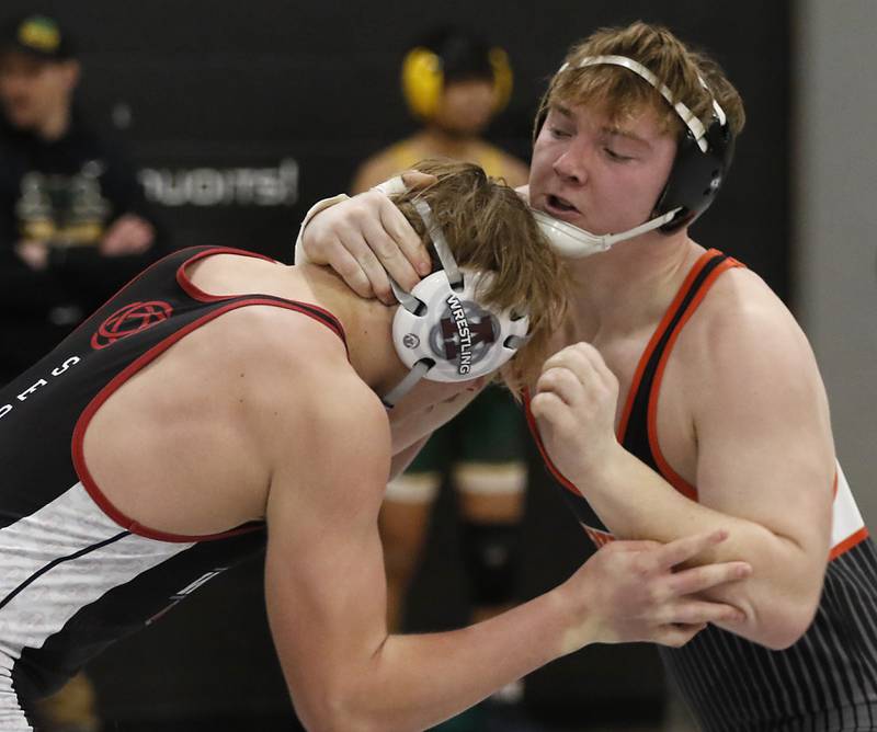 Crystal Lake Central’s Tommy McNeil trie to takedown Antioch’s Owen Shea in a 215-pound semifinal match of the IHSA 2A Antioch Wrestling Regional on Saturday, Feb. 8, 2025, at Antioch High School.