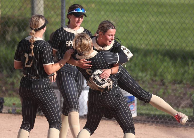 Sycamore pitcher Bella Jacobs gets a lift from Ema Durst after throwing a shutout Monday, May 12, 2025, in their game against Ottawa at Sycamore High School.