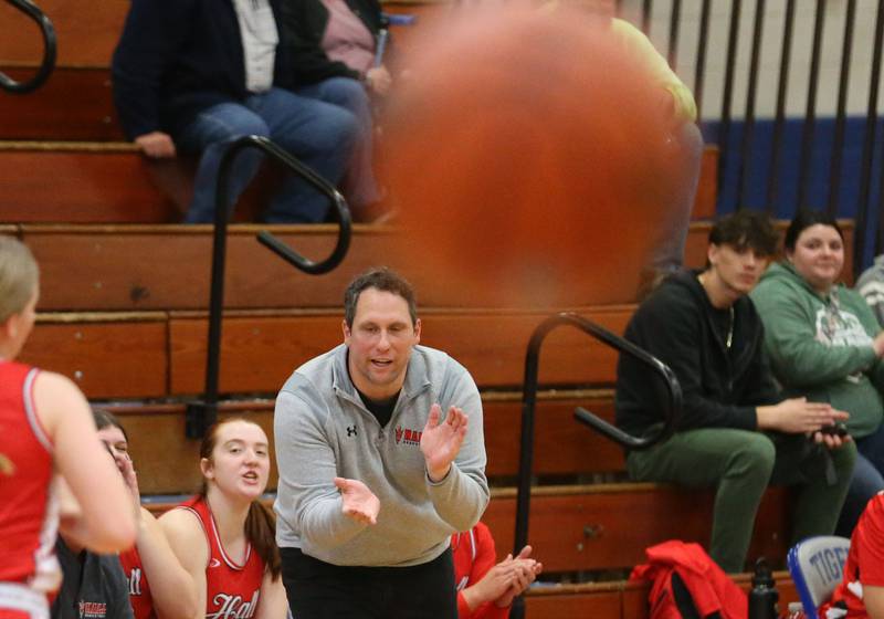 Hall head girls basketball coach TJ Orlandi applauds his team on during a game against Illinois Valley Central during the Princeton Holiday Girls Basketball Tournament on Tuesday, Nov. 19, 2024 at Princeton High School.