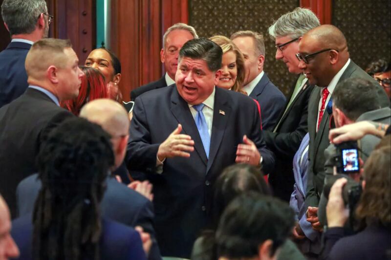 Governor JB Pritzker enters the House chamber on Wednesday, February 19
