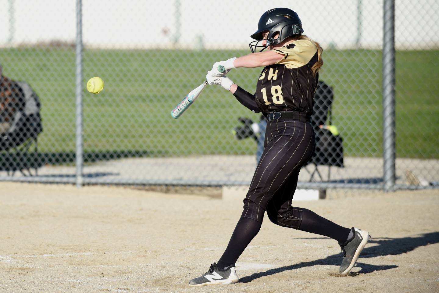 Bishop McNamara's Bridget Bertrand hits a pitch during a home game against Aurora Christian Tuesday, April 8, 2025.