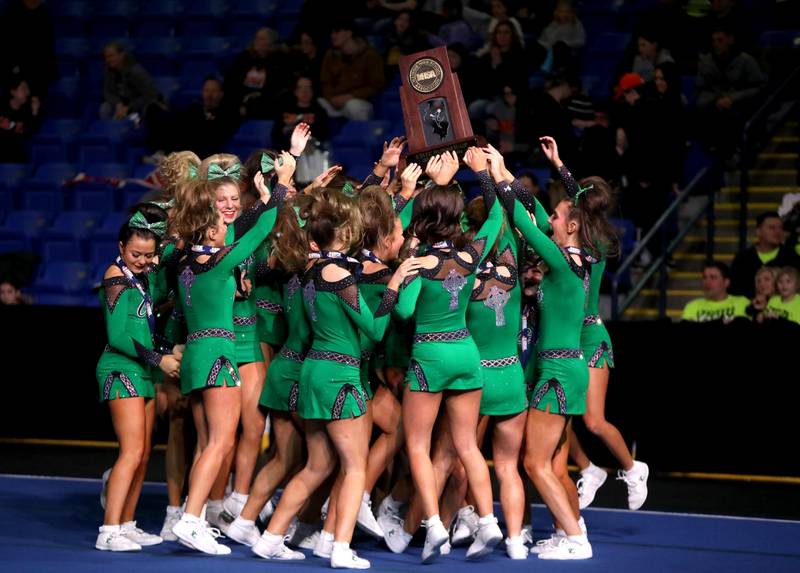 Members of the Providence Catholic cheerleading team celebrate their second-place finish in the medium team division of the IHSA State Finals on Saturday, Feb. 8, 2025 at Grossinger Motors Arena in Bloomington.