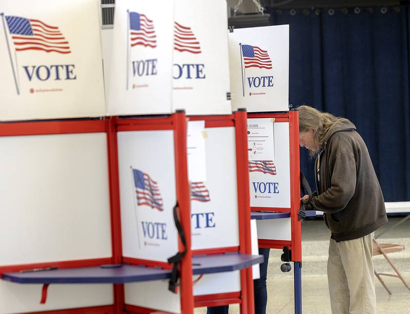 Robert Flowers works on his ballot Tuesday, Nov. 5, 2024, at the Rock Falls Community Center.