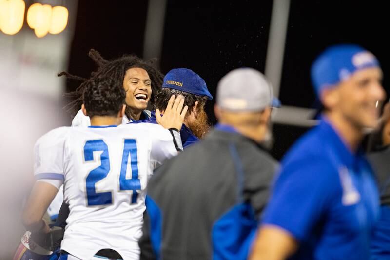 Joliet Central Celebrates a win by dumping water on head coach Tom Hart  during a game against Plainfield Central on Friday Oct. 11, 2024 at Plainfield Central High School. This was Joliet Centrals first win since 2019