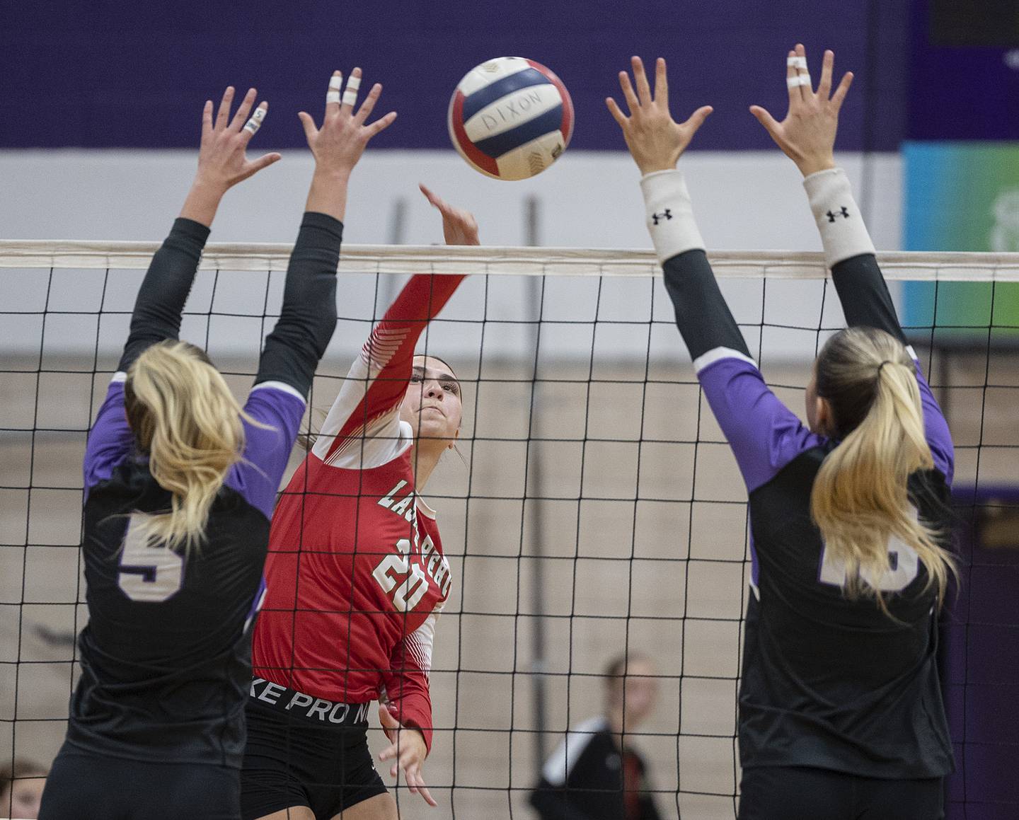 LaSalle-Peru’s Anna Riva works against Dixon’s Morgan Hargrave (left) and Solis Thompson Wednesday, Sept. 10, 2025.