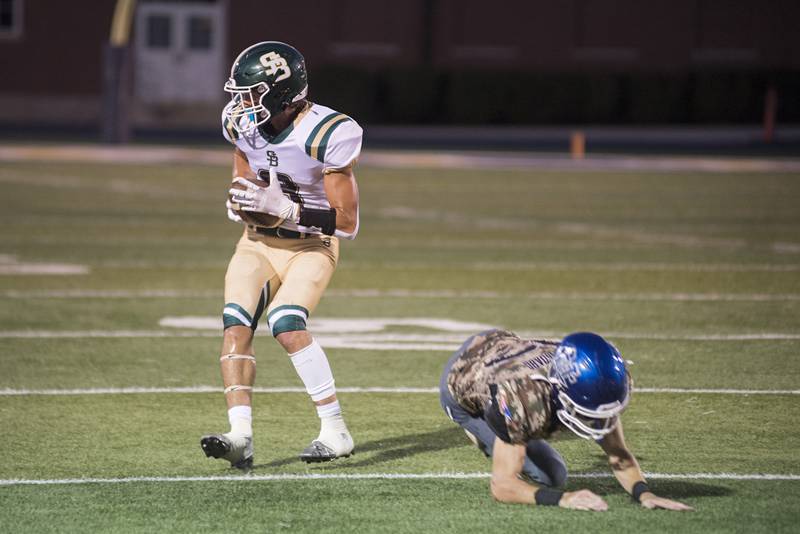 St. Bede’s Connor Brown hauls in a pass and runs for a touchdown against Newman Friday, Sept. 16, 2022.