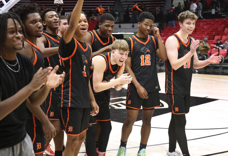 DeKalb players celebrate after their win over Sycamore Friday, Jan. 31, 2025, in the FNBO Challenge in the Convocation Center at Northern Illinois University in DeKalb.