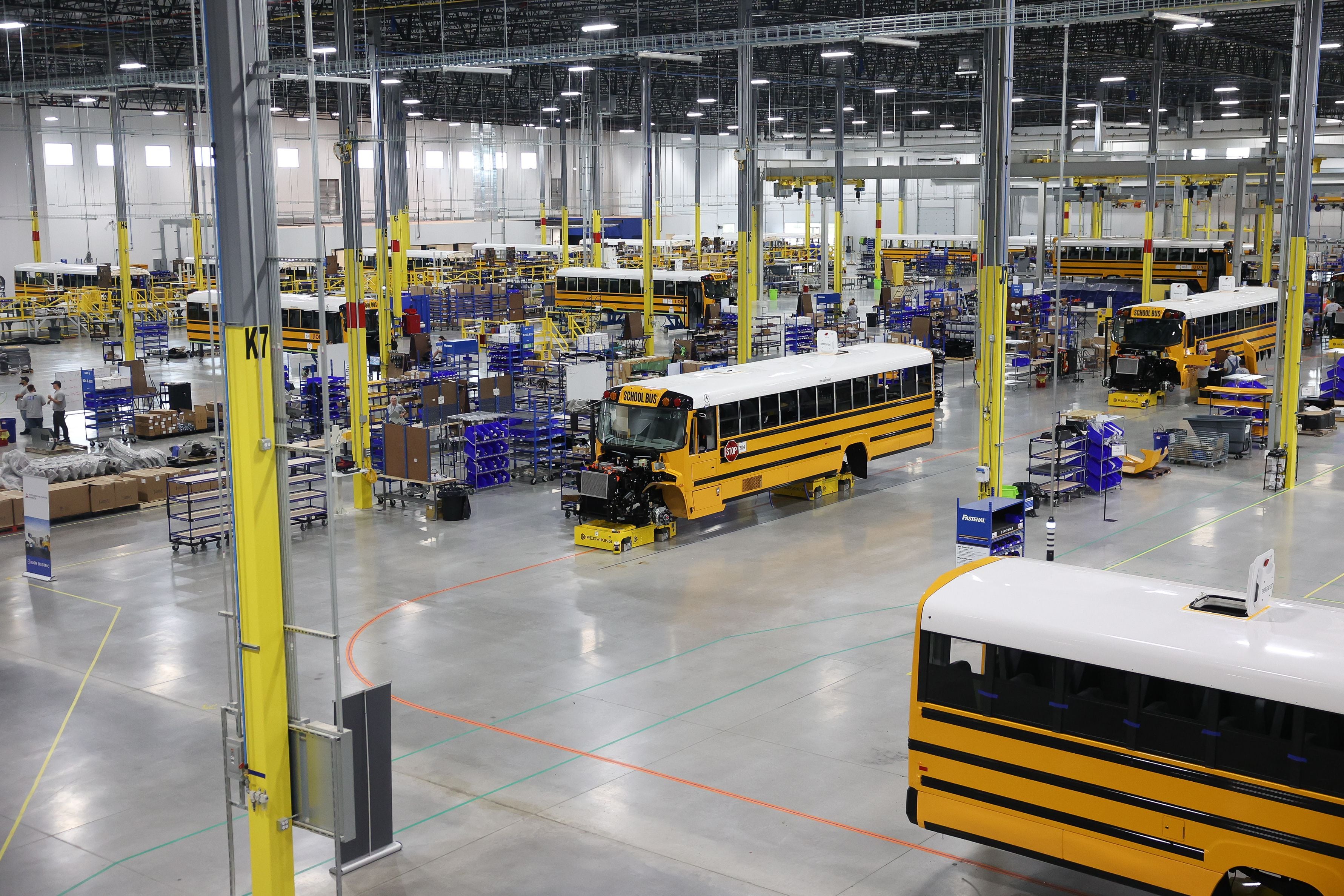 Dozens of buses are assembled at the Lion Electric manufacturing facility on Friday, July 21st, 2023 in Joliet.