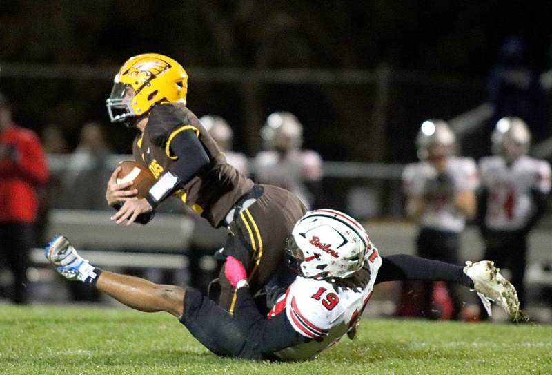 Jacobs’ quarterback Connor Goehring is sacked by Bradley-Bourbonnais’ Ty Thurmond in first-round IHSA football playoff action on Friday, Nov. 1, 2024, at  Jacobs High School  in Algonquin.