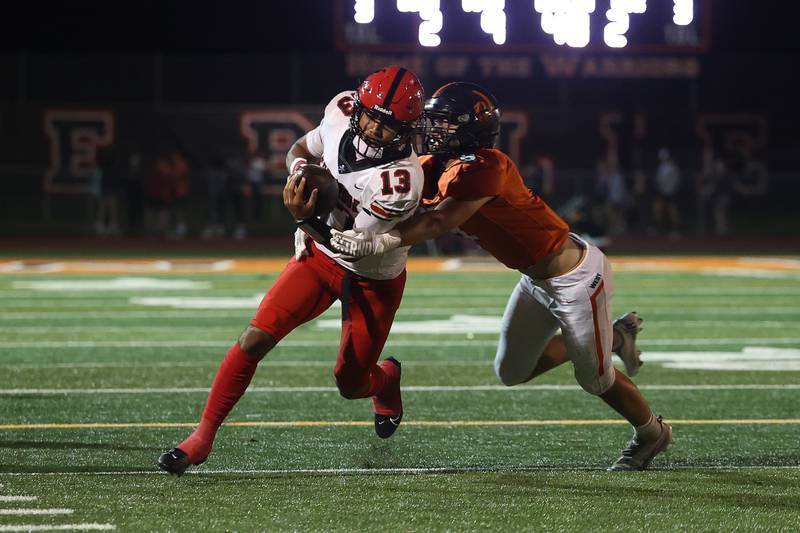 Bolingbrook’s Jonas Williams rushes for a first down against Lincoln-Way West on Friday, Sept. 22 in New Lenox.
