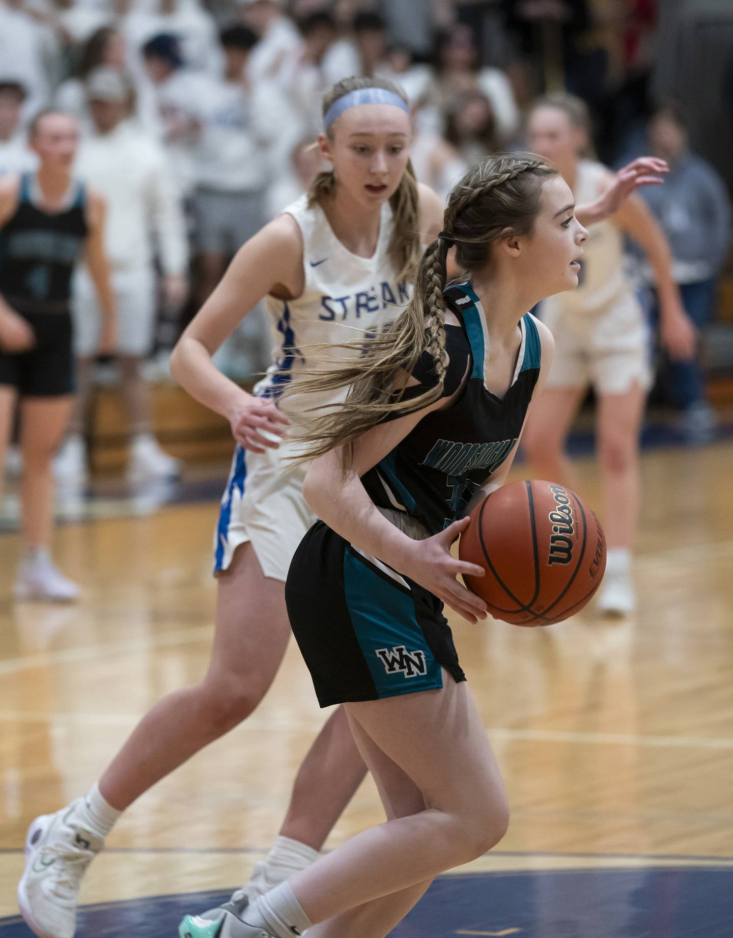 Woodstock North's Adelyn Crabill looks to pass as Woodstock's Lily Novelle defends during their game on Wednesday, February 7, 2024 at Woodstock High School. Ryan Rayburn for Shaw Local