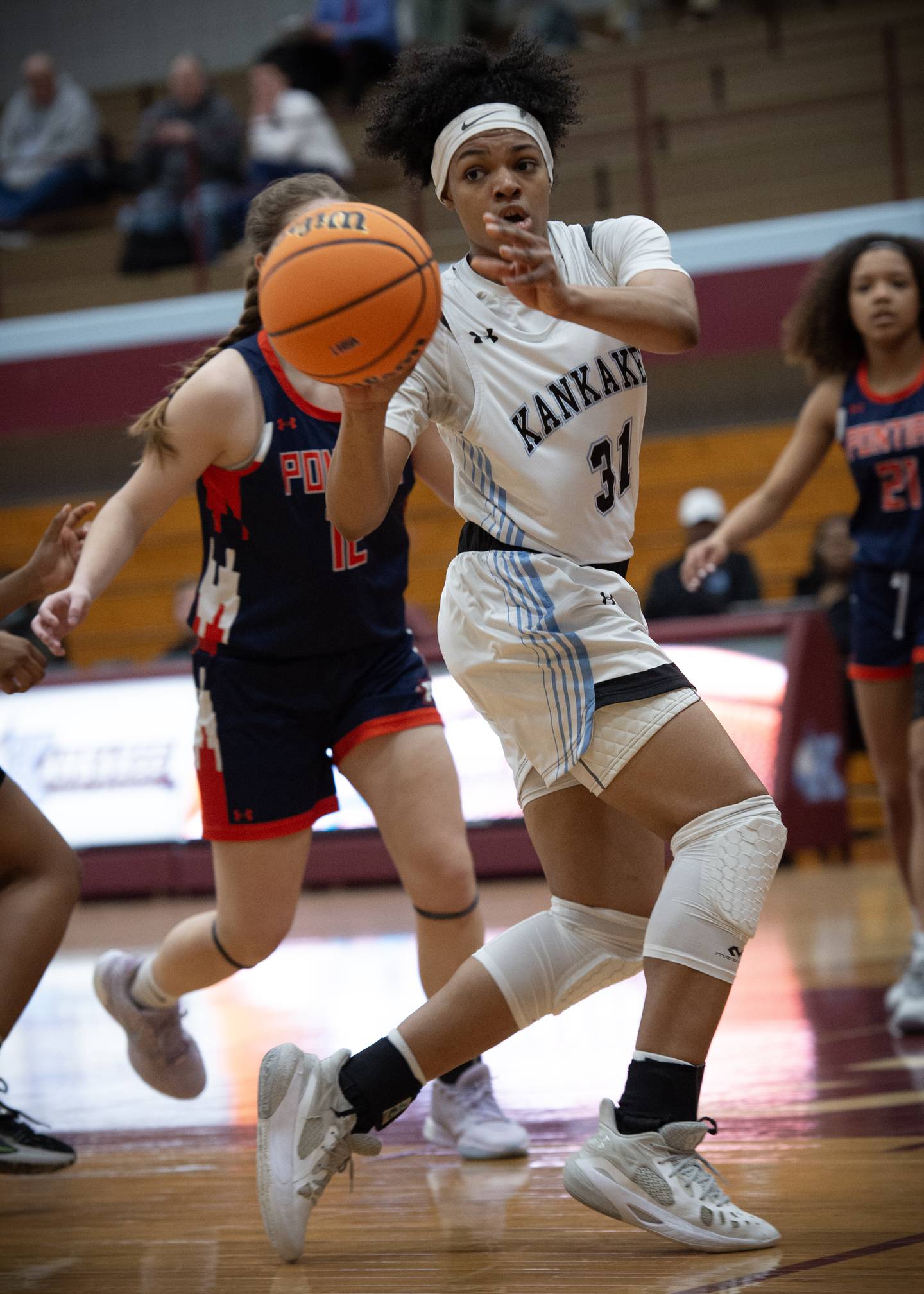 Kankakee's TaLeah Turner passes off the ball while making a drive toward the net during Tuesday's Class 3A Regional against Pontiac.