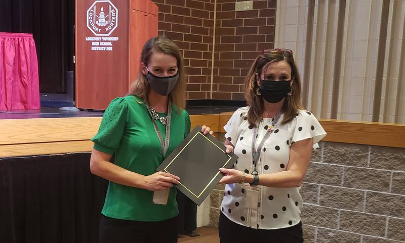 Pictured, from left, are Tammy Gallagher, LTHS gifted coordinator, and Lorie Cristofaro, LTHS assistant superintendent of curriculum and instruction. The Lockport Township High School board of education recently recognized Gallagher because nearly 1,000 LTHS students earned college credit due to Gallagher’s “creativity and her steadfast support of AP teachers and students,” according to a news release from LTHS.