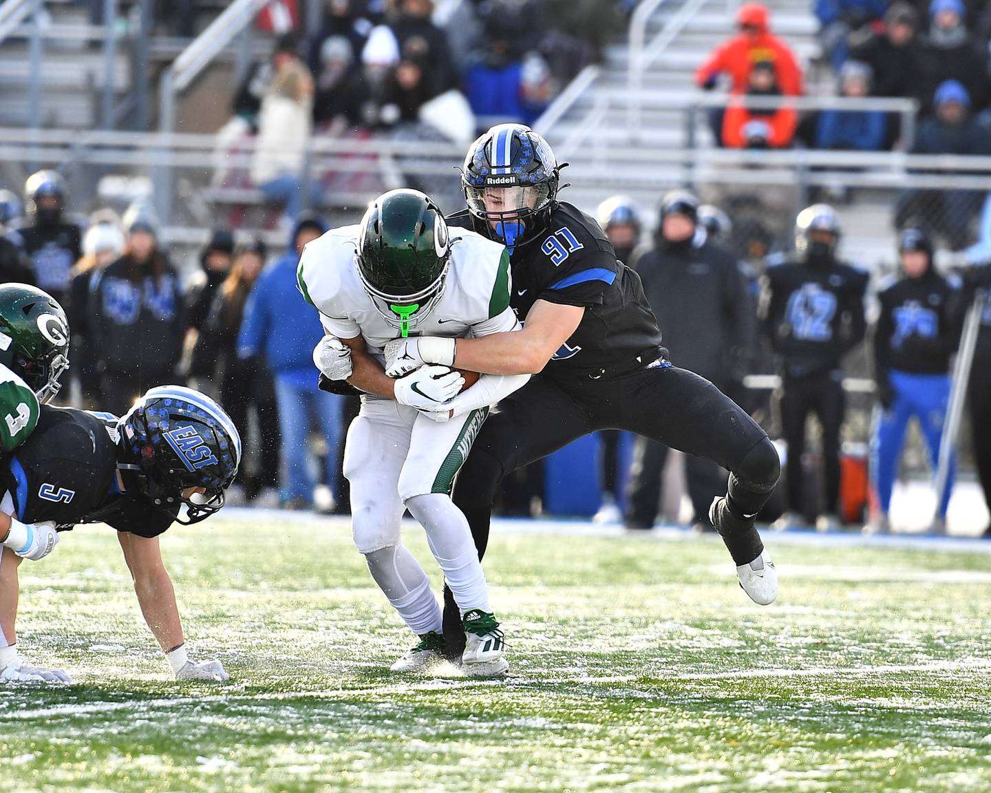 Lincoln-Way East's Caden O'rourke (91) tackles Glenbard West's running back during the IHSA Class 8A Semifinals on Saturday, November 19, 2022, at Frankfort.