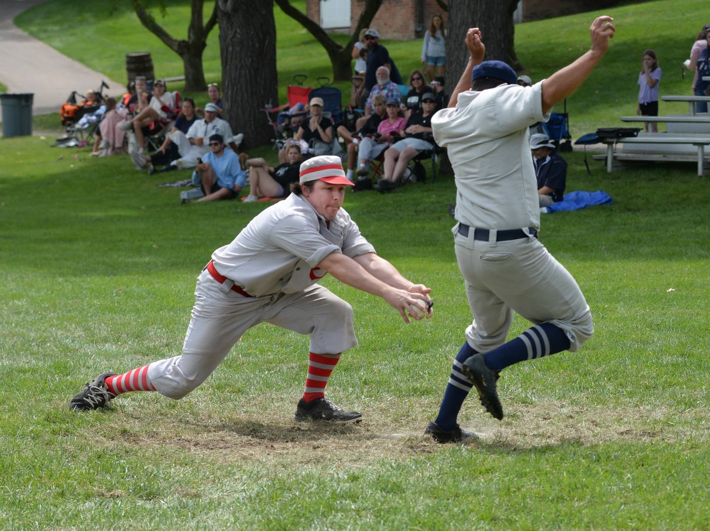 Ganymede catcher Tom “Dandy” Lesniak reaches to try and tag a Buckeye runner during the championship of the Second Class division on Sunday, Aug. 11, 2024.