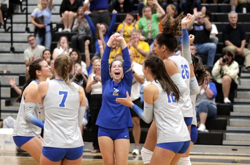 St. Charles North players celebrate their win over St. Charles East during a game at East on Tuesday, Sept. 26, 2023.
