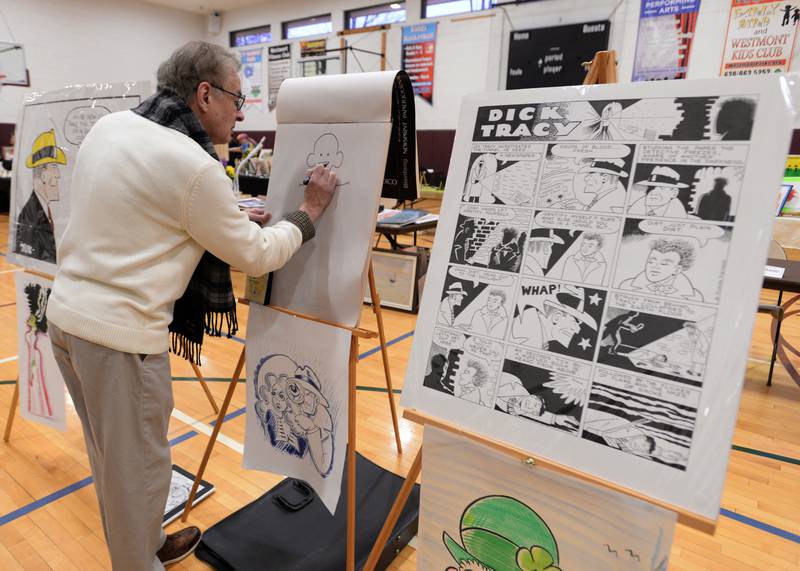 Westmont cartoonist Rchard Pietrzyk creates a piece while attending the Westmont Art Show held at the Community Center Sunday March 19, 2023.