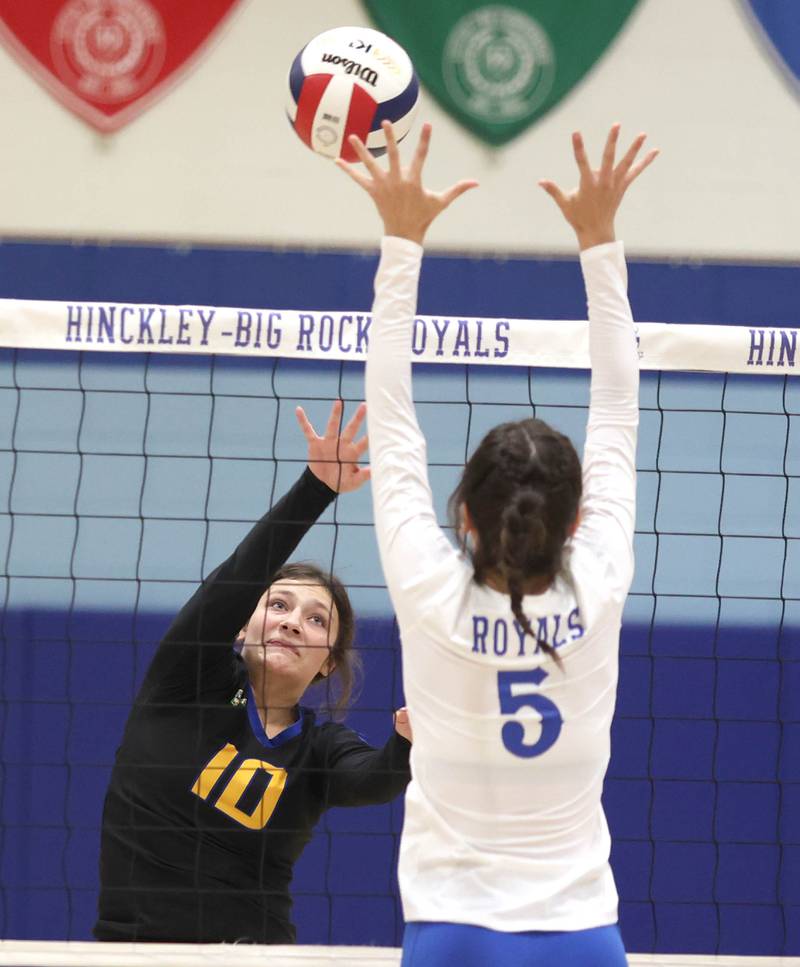 Somonauk's Alexis Matejovsky tries to tip the ball over Hinckley-Big Rock's ILY Hunt during their match Thursday, Sept. 15, 2022, at Hinckley-Big Rock High School.