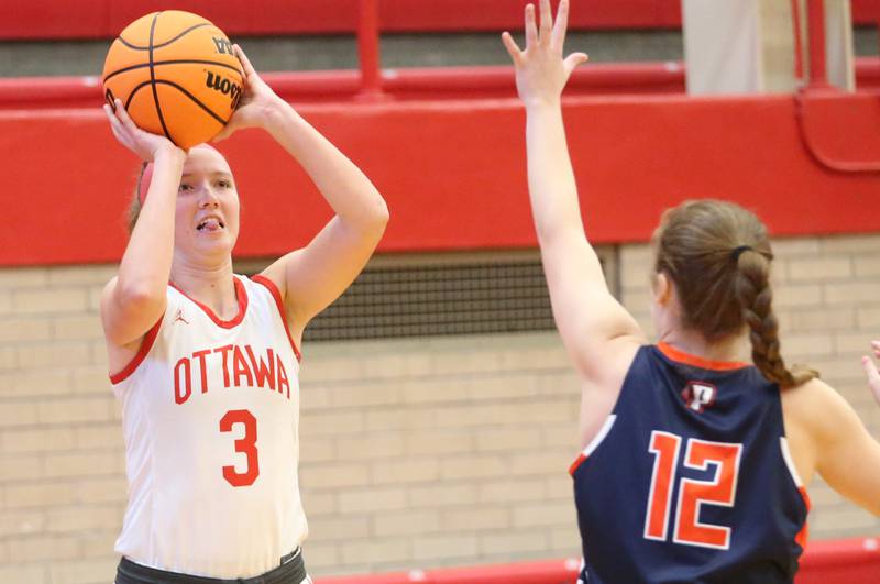 Ottawa's Skylar Dorsey shoots a jump shot over Pontiac's Kaitlin Leonard during the Ottawa Girls Holiday Tournament on Monday, Dec. 16, 2024 in Kingman Gym at Ottawa High School.