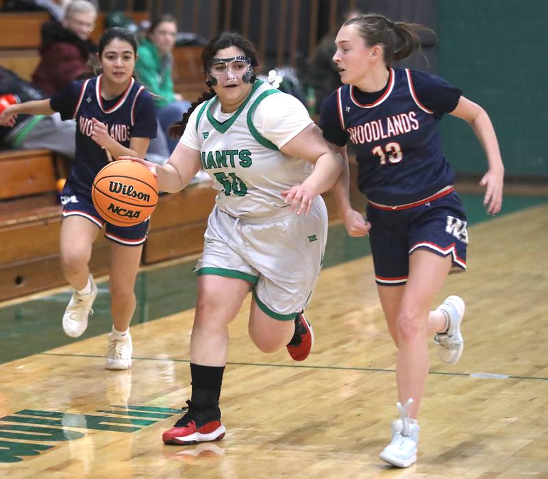 Alden-Hebron's Martha Aguilar brings the ball up the court against Woodlands Academy's MacKenzie Lockhart during a nononference girls basketball game on Thursday, Jan. 29, 2026, at Alden-Hebron High School in Hebron.