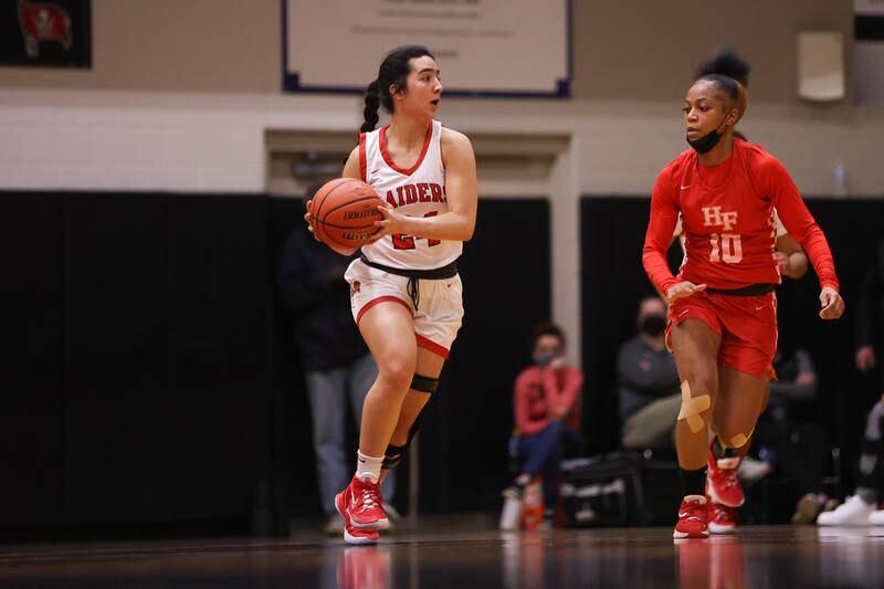 Bolingbrook’s Yahaira Bueno looks to pass against Homewood-Flossmoor in the Class 4A Bolingbrook Sectional championship. Thursday, Feb. 24, 2022, in Bolingbrook.