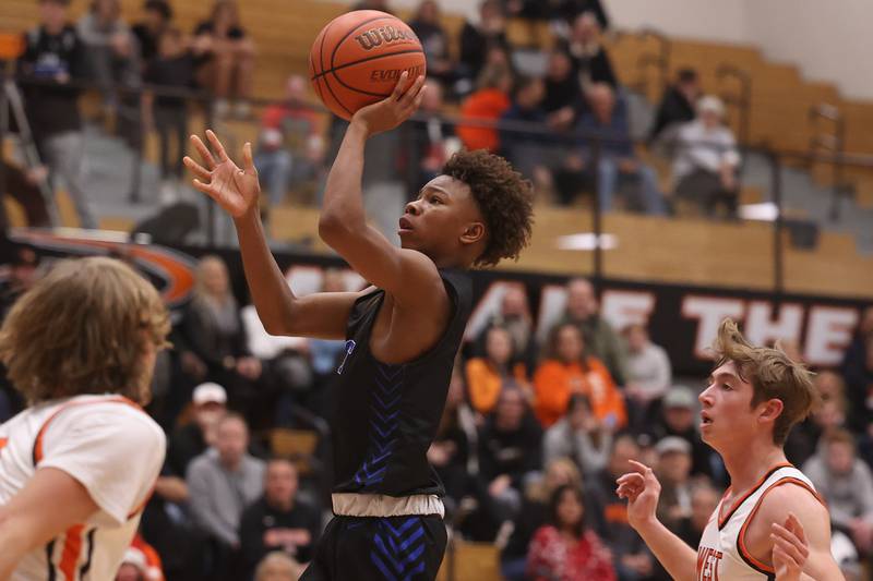 Lincoln-Way East’s BJ Powell puts up a shot against Lincoln-Way West.