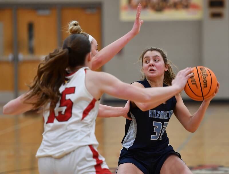 Nazareth’s Stella Sakalas looks to pass while double teamed by Benet during a game on January 29, 2025 at Benet Academy in Lisle.