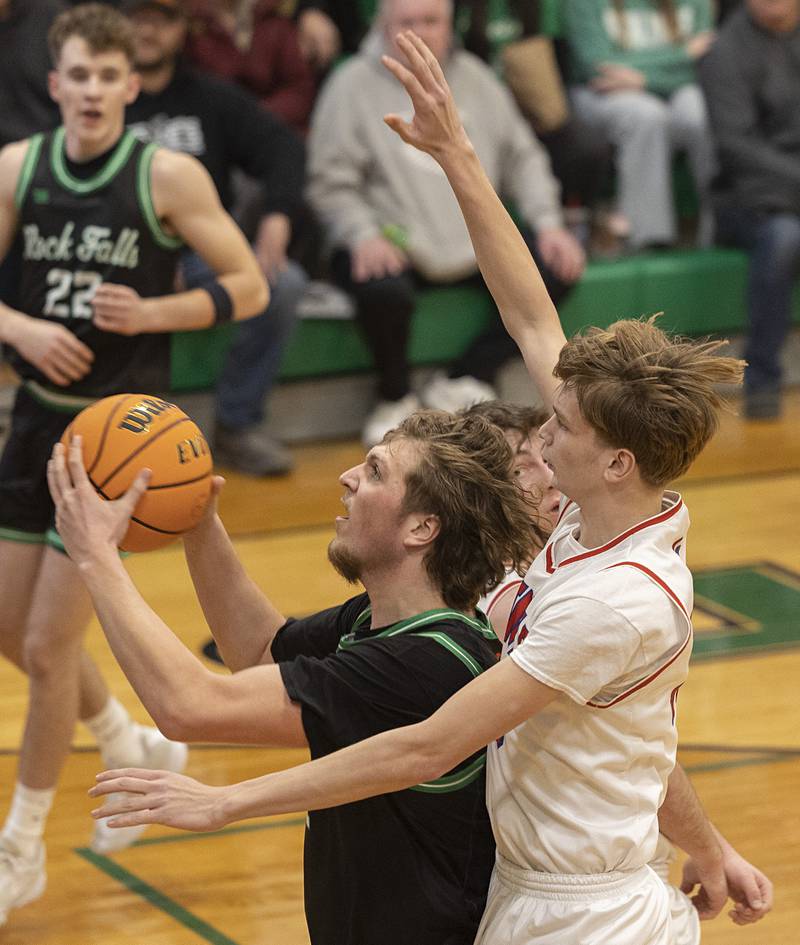 Rock Falls’ Cole Mulnix works below the basket against Oregon Wednesday, Feb. 25, 2026, in the Class 2A regional semifinal at Rock Falls High School.