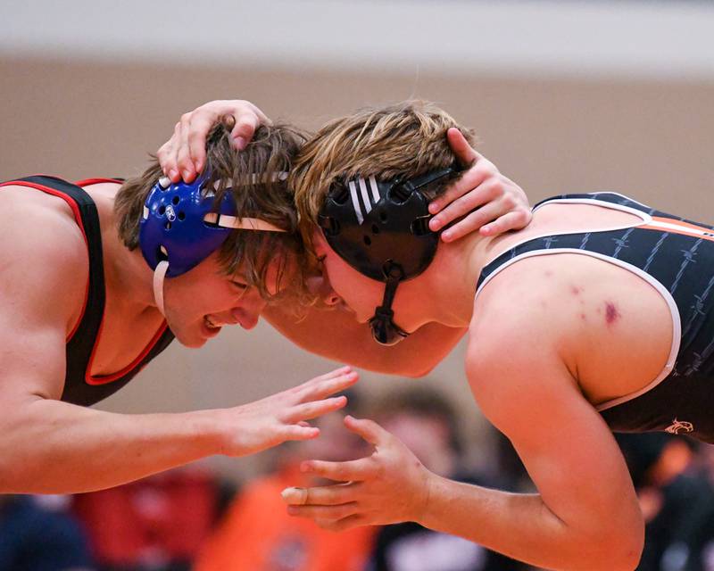 DeKalb's Sean Kolkebeck (right) wrestles against Naperville Central's Henry Rydwelski on Saturday, Dec. 28, 2024, in the 175-pound weight class during the Don Flavin Invite held at DeKalb High School.